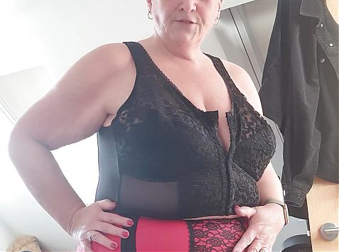 Red and black girdle, and a cheeky view of that ass